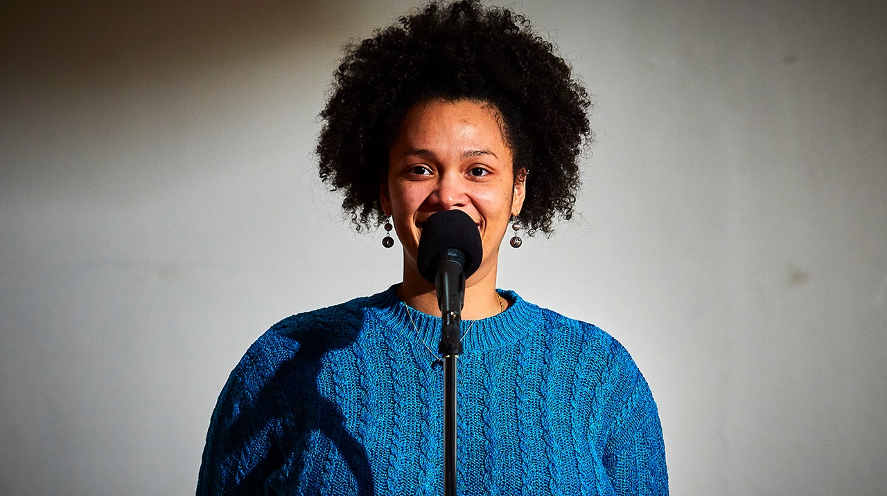 Navrioska at the microphone — NPR The Moth Radio Hour